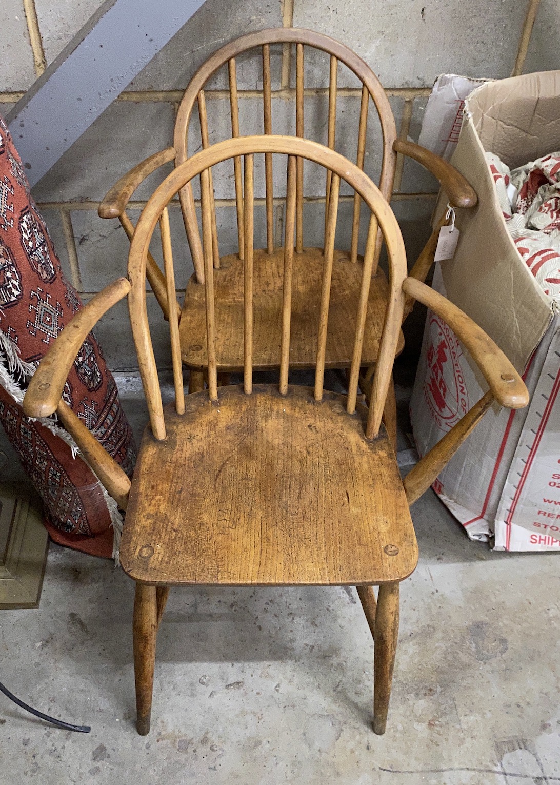 A pair of Ercol elm and beech elbow chairs, width 60cm, depth 40cm, height 82cm